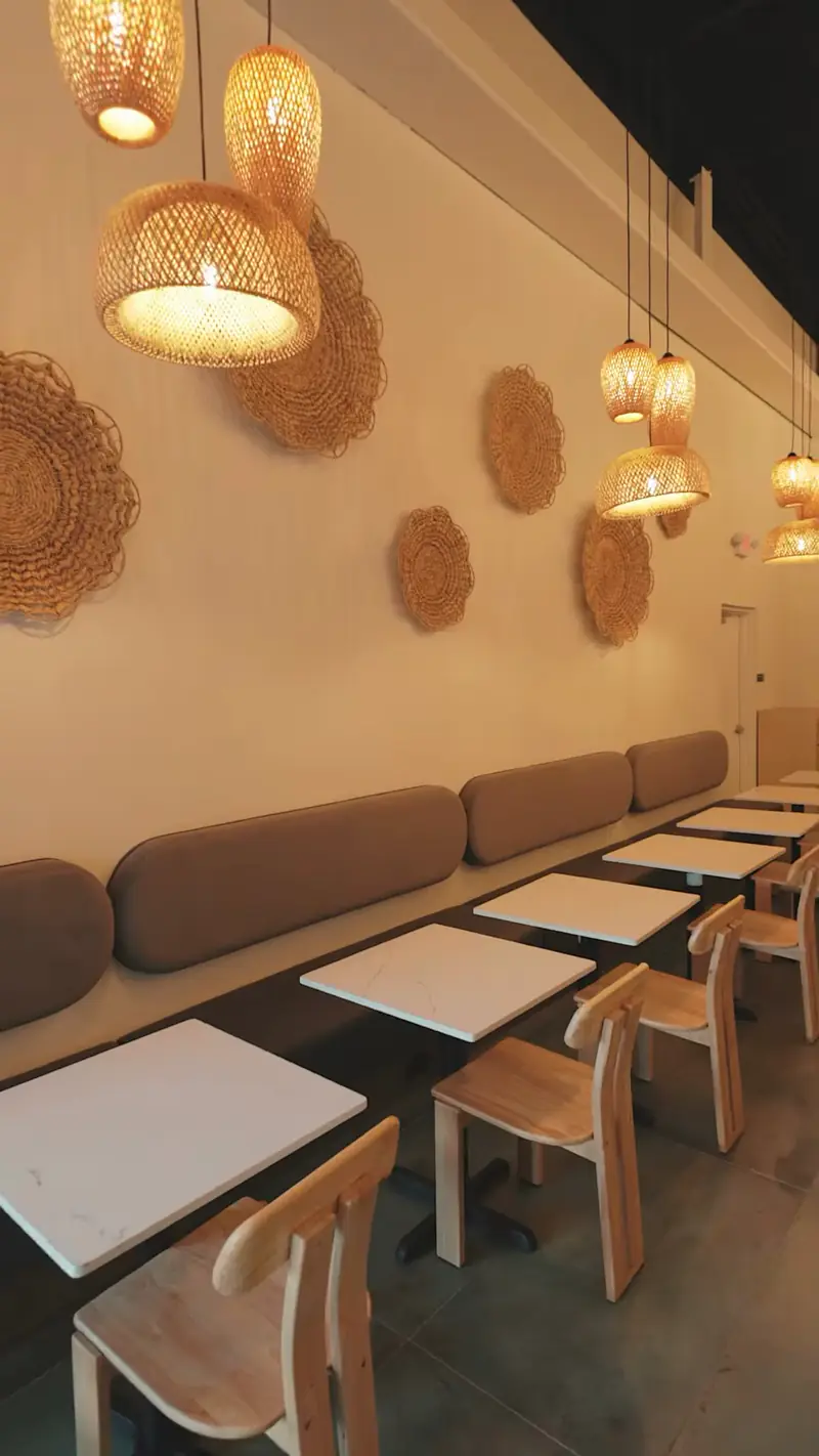 Banquette seating and tables inside Kiki Kafé