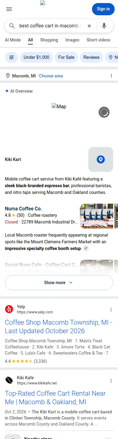 Google search on a phone for best coffee cart in Macomb Michigan. The AI answer lists the Kiki Kart first.