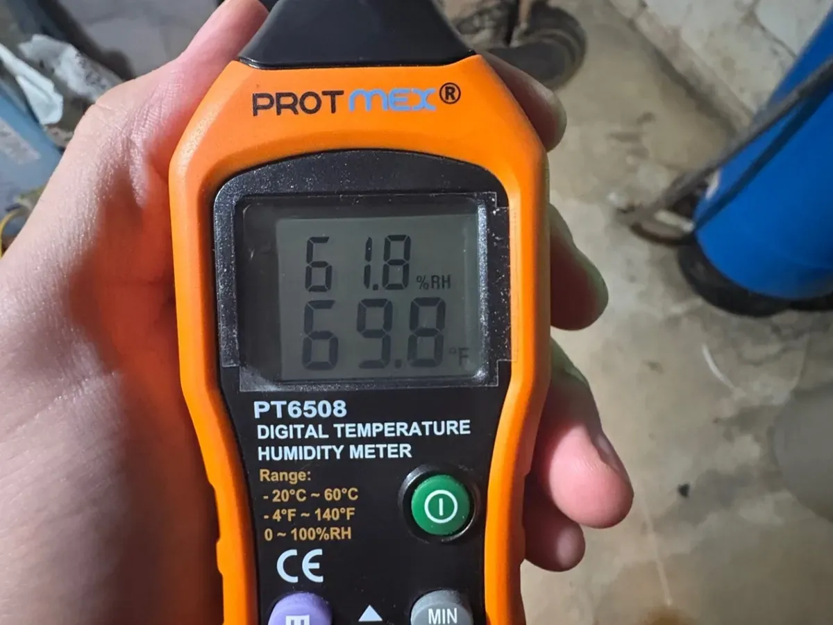 A meter reading temperature and humidity on a West Bloomfield job