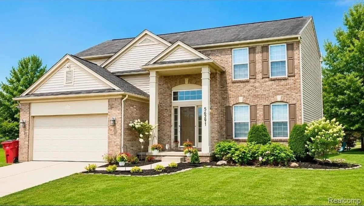 Front of the colonial home at 56291 Hastings Dr, Macomb Township
